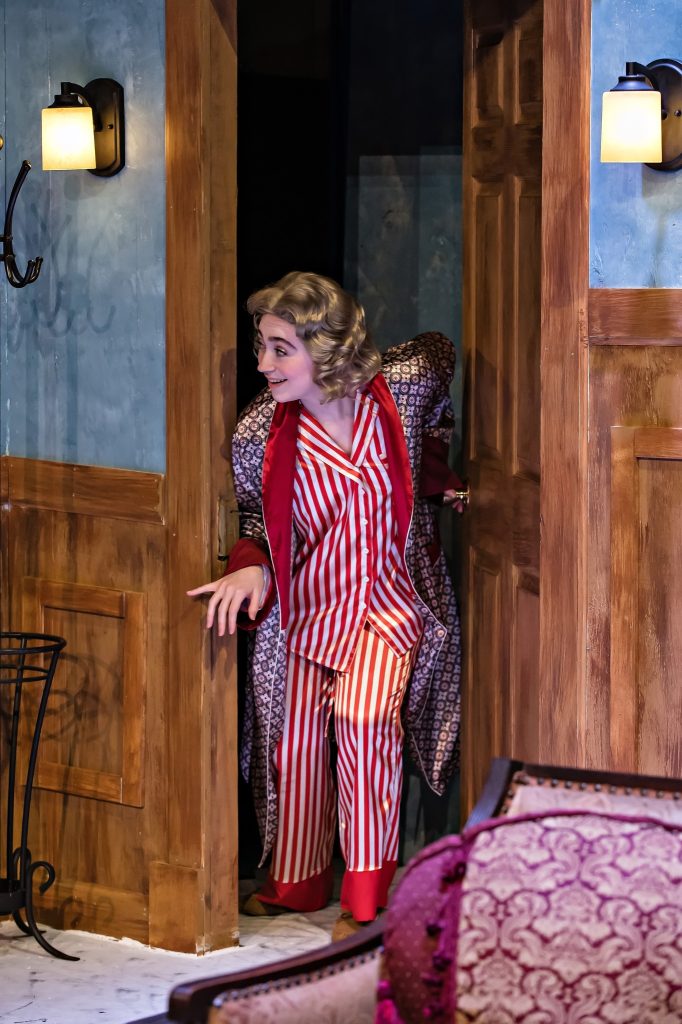 lady peering through door excitedly